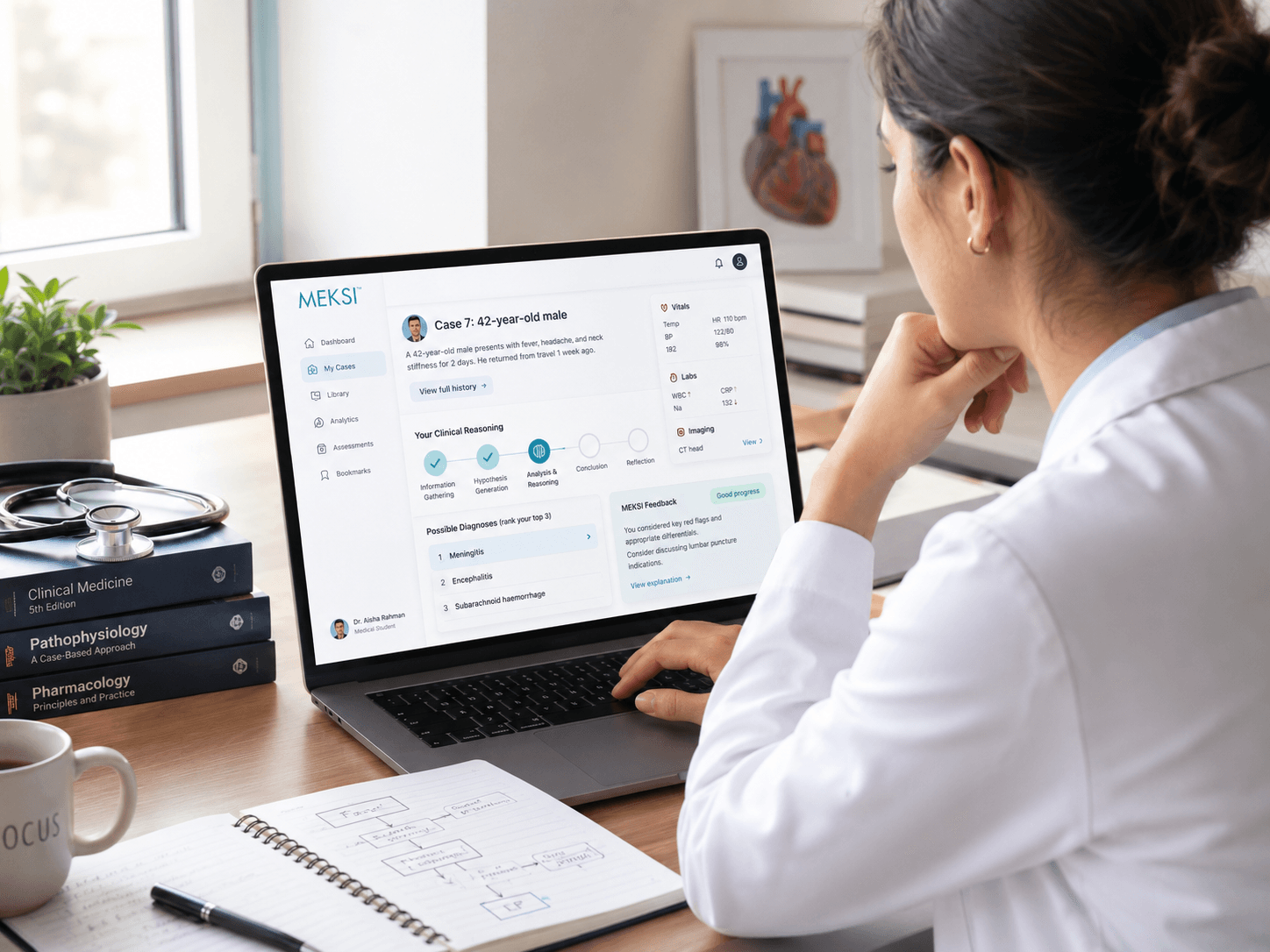 A clinician practising a consultation on the MEKSI platform on a laptop